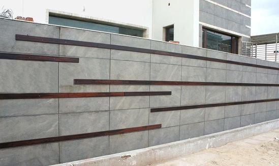 boundary wall design made up of beautiful tiles